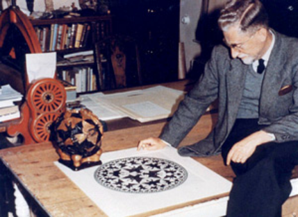M.C. Escher, looking at one of his works
