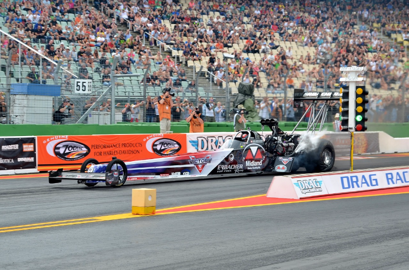 [url=https://pixabay.com/en/top-fuel-dragster-motorsport-burn-1353229/]"Top-Fuel Dragster"[/url] by [url=https://pixabay.com/en/users/clickphoto-2417268/]Click Photo[/url], [url=http://pixabay.com/]pixabay[/url]

Explanation: A top-fuel dragster accelerates from rest to over 300 mph in just over four seconds.  I worked as a vehicle dynamics consultant years ago and modeled top fuel dragsters for the company that made the world's fastest dragsters at the time, McKinney Corporation.  Notice the wrinkles in the rear tires as the dragster attempts to put around 6000 horsepower to the ground.
