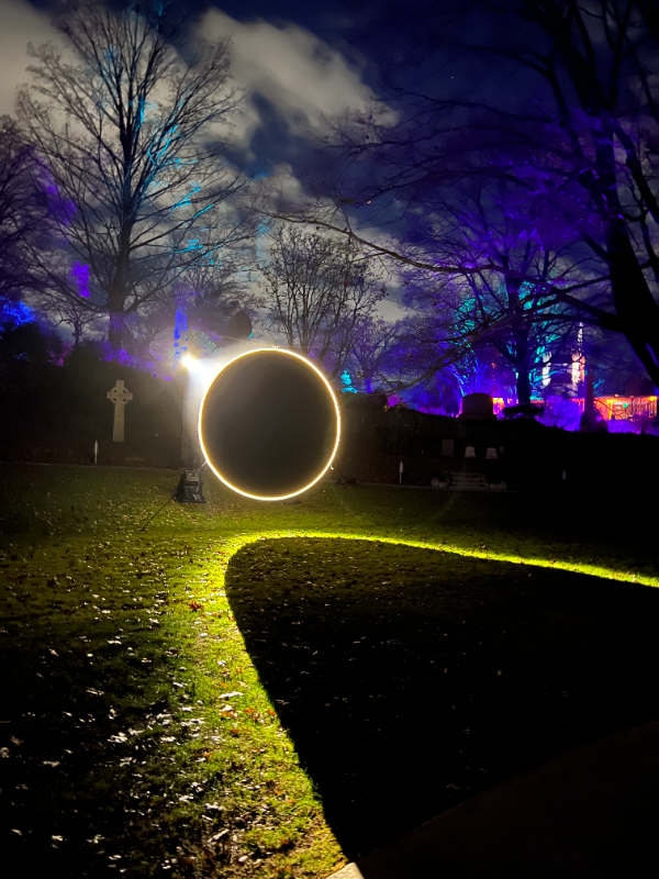 One of the features in Mt. Auburn Cemetery's "Solstice" light experience (Cambridge, MA)... the shadow appears to be some sort of conic section. Scroll down for an interactive applet (where you can adjust a bunch of parameters)